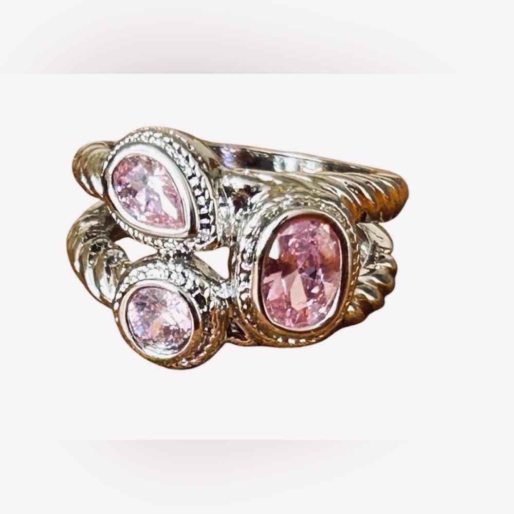 Brand new, silver/pink coloured ring, size 7.